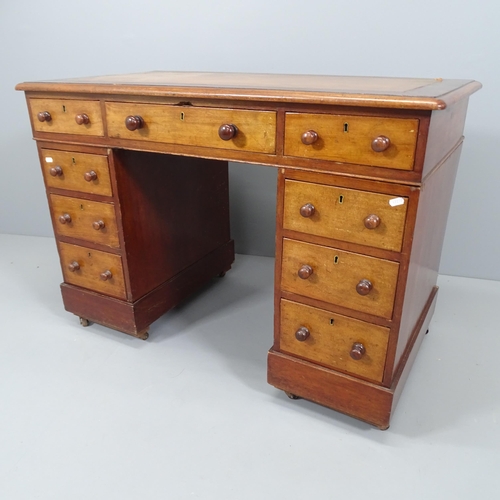 2191 - An Edwardian mahogany twin-pedestal writing desk, with nine drawers and tooled and embossed brown le... 