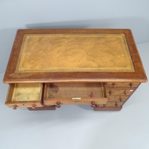 2191 - An Edwardian mahogany twin-pedestal writing desk, with nine drawers and tooled and embossed brown le... 