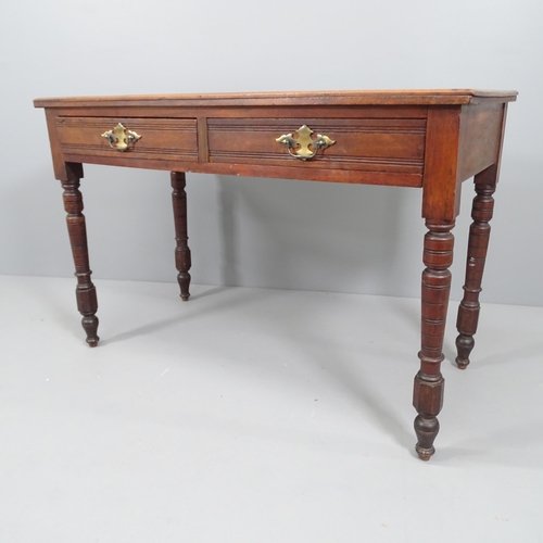 2194 - A Victorian mahogany writing table, with two drawers and raised on turned legs. 108x71x50cm