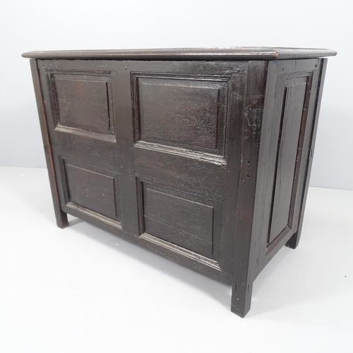 2199 - An antique panelled oak blanket box, raised on stile legs. 94x70x51cm