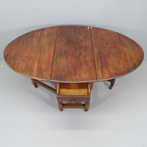 2209 - An antique oak oval gateleg dining table. 92x75x41cm