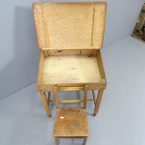 2214 - A vintage oak school desk, with label for Swallow Toys of London, 55x70x45cm, and a child's chair. (... 