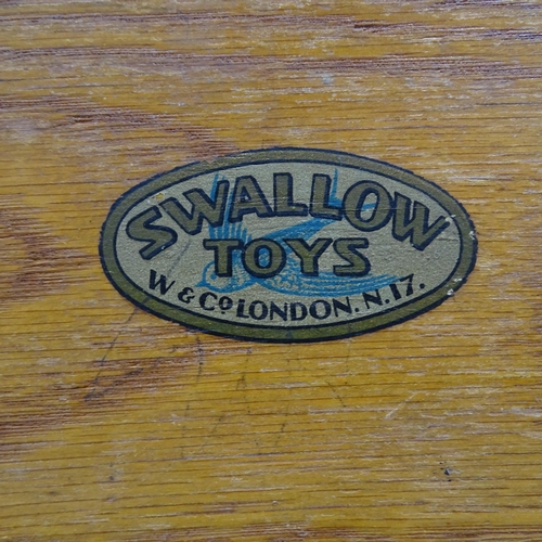 2214 - A vintage oak school desk, with label for Swallow Toys of London, 55x70x45cm, and a child's chair. (... 