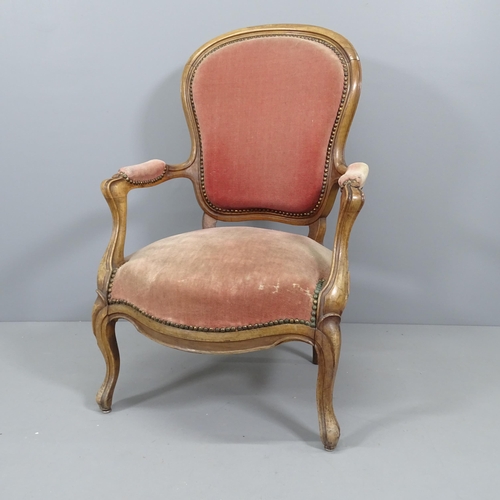 2215 - A Victorian mahogany and upholstered open arm lounge chair.