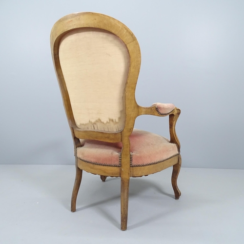 2215 - A Victorian mahogany and upholstered open arm lounge chair.