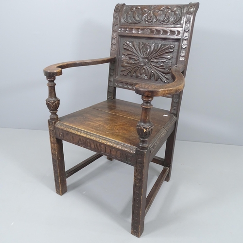 2226 - An antique oak wainscot chair, with chip carved Green Man decoration. Overall 71x105x63cm, Seat 46x4... 