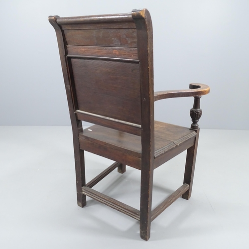 2226 - An antique oak wainscot chair, with chip carved Green Man decoration. Overall 71x105x63cm, Seat 46x4... 