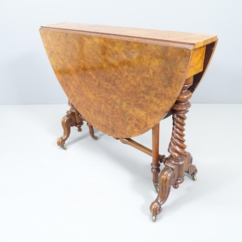 2228 - A Victorian burr walnut oval Sutherland drop-leaf table, on mahogany base. 90x72x14cm (extending to ... 