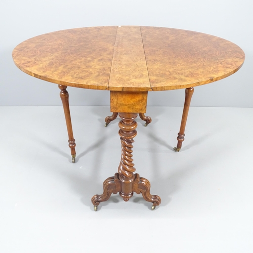 2228 - A Victorian burr walnut oval Sutherland drop-leaf table, on mahogany base. 90x72x14cm (extending to ... 