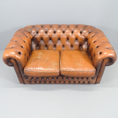 2229 - A Brown studded leather upholstered button-back Chesterfield sofa. Overall 152x72x90cm