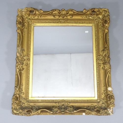 2230 - An antique giltwood and gesso framed wall mirror. 87x77cm