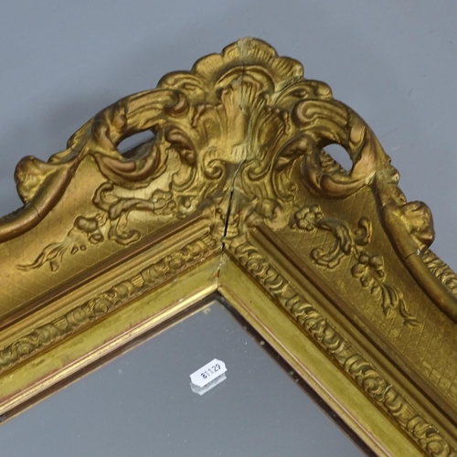 2230 - An antique giltwood and gesso framed wall mirror. 87x77cm