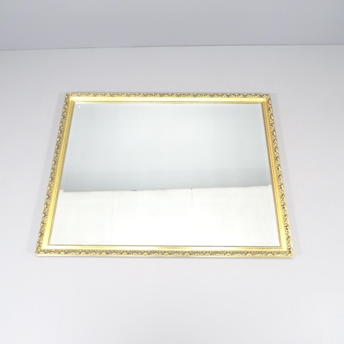 2232 - A modern gilt-framed wall mirror. 132x103cm