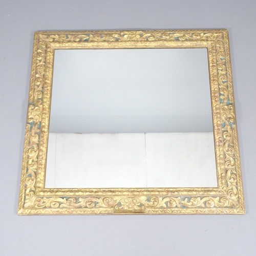 2234 - A continental gilt painted wall mirror, with applied carved decoration. 96x103x6cm.