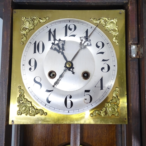 2240 - A walnut cased 8-day wall clock. Height 90cm.