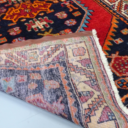 2254 - A red-ground Qashqai rug, 195x35cm