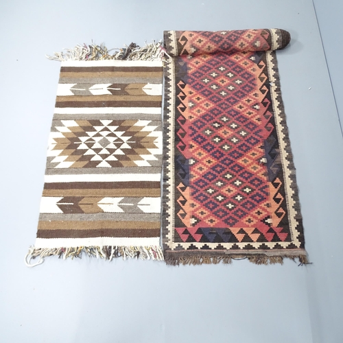 2257 - A red-ground Kilim runner, 357x73cm, and a woollen mat, 112x62cm.