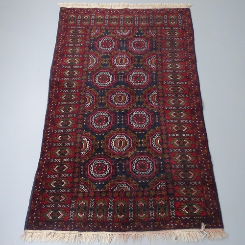 2262 - A red-ground Baluchi rug. 193x122cm.