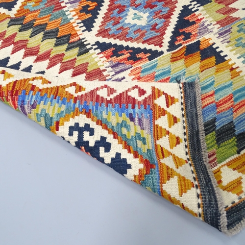 2263 - A Chobi Kilim rug. 197x121cm