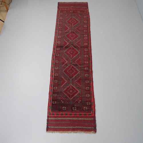 2264 - A red-ground Meshwani runner. 242x57cm.