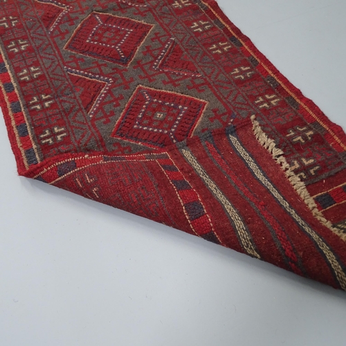 2264 - A red-ground Meshwani runner. 242x57cm.