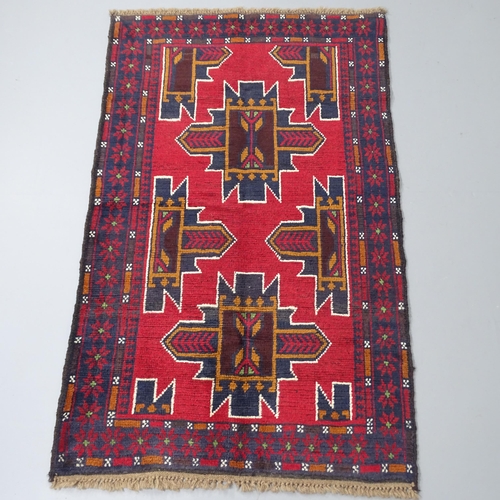 2270 - A red ground Baluchi rug, 147x89cm