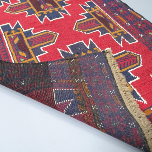 2270 - A red ground Baluchi rug, 147x89cm