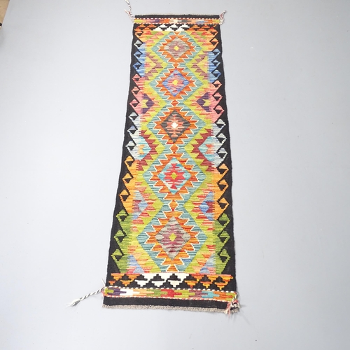 2271 - A Chobi Kilim runner. 197x59cm.