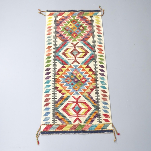 2273 - A Chobi Kilim runner. 147x66cm