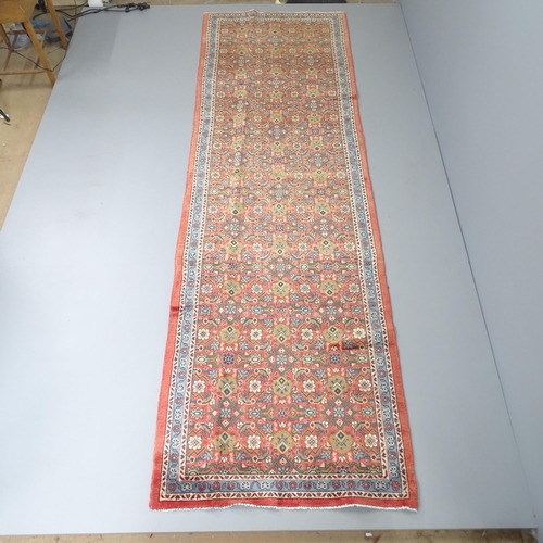 2283 - A red-ground Hamadan runner. 352x105cm