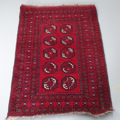 2287 - A red-ground Afghan rug, 122x90cm.