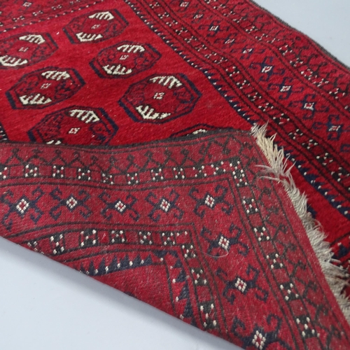 2287 - A red-ground Afghan rug, 122x90cm.