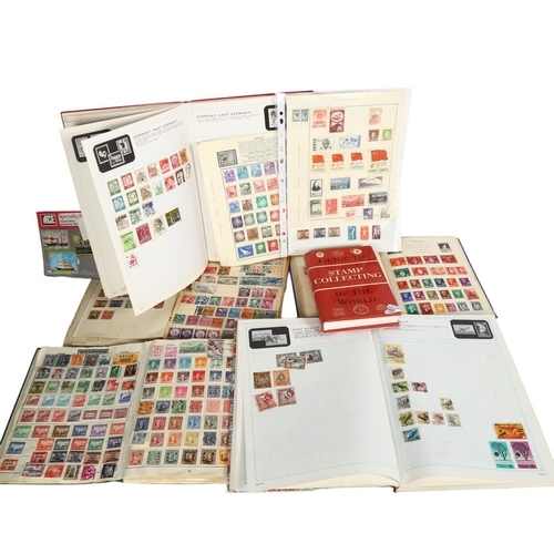 571 - Various postage stamp albums and a guidebook