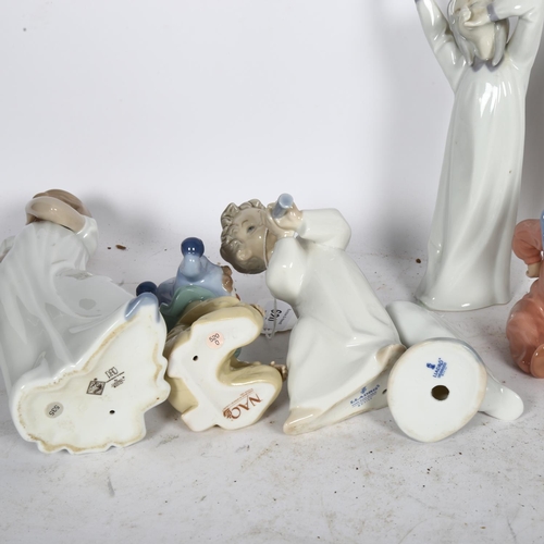 620 - NAO porcelain child clown, 28cm, a pair of smaller clowns, etc