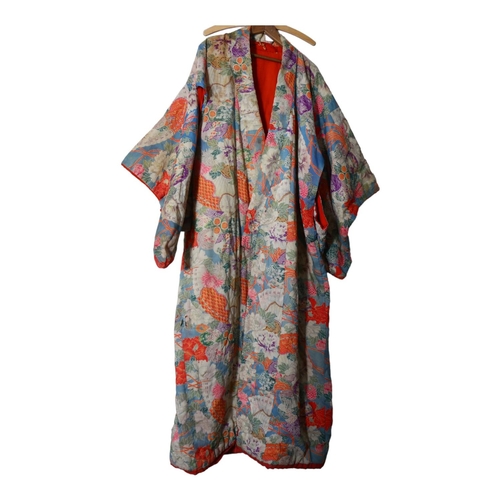 627 - An early 20th century Japanese silk Kimono, with embroidered floral decoration, padded and scarlet  ... 