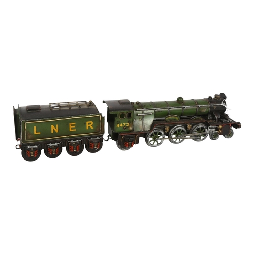 641 - A tinplate Flying Scotsman model with LNER tender, reference on front of locomotive 4472, length inc... 