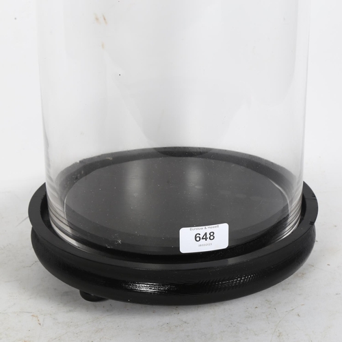 648 - A modern glass dome on wooden base, height including base 56cm