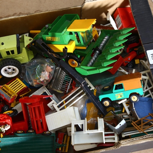 654 - A quantity of Britains farmyard vehicles and accessories, both 70s and 80s vehicles, other manufactu... 