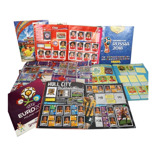 665 - A quantity of various Panini sticker and card albums, all football related, including Panini's Footb... 