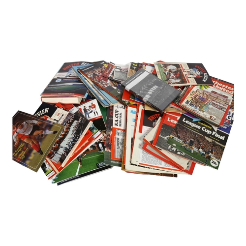 670 - A quantity of Manchester United Football Club ephemera, including various football programmes, used ... 