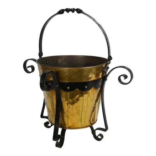 676 - An Arts and Crafts brass and wrought-iron bucket, H55cm