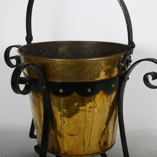 676 - An Arts and Crafts brass and wrought-iron bucket, H55cm