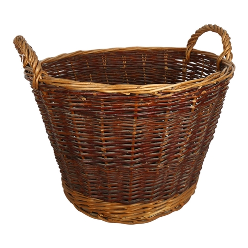 678 - A wicker log basket, 51cm across