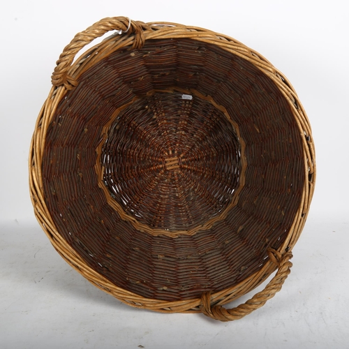 678 - A wicker log basket, 51cm across