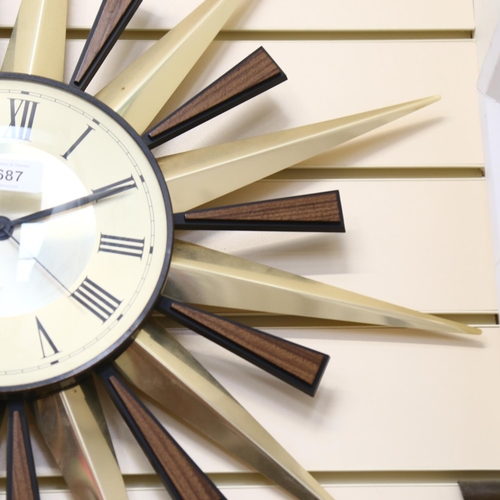 687 - Vintage quartz sunburst wall clock, 55cm overall