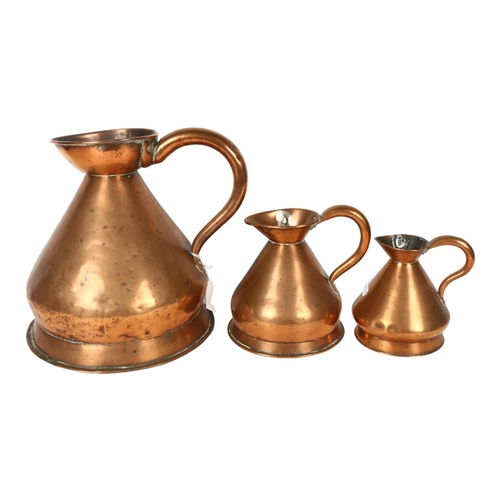 702 - A graduated set of Antique copper measures, H28cm