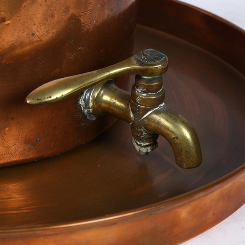 703 - Antique copper jelly mould, a copper tray, and a copper and brass tea urn and cover, H29cm