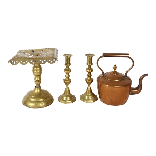 704 - A copper kettle, a brass trivet, H23cm, and a pair of turned brass candlesticks