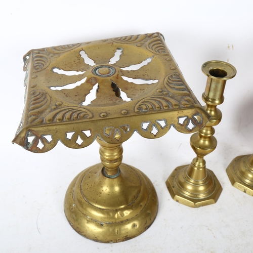 704 - A copper kettle, a brass trivet, H23cm, and a pair of turned brass candlesticks