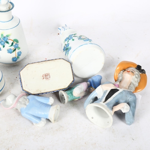 715 - A Chinese porcelain box, L8cm, and 3 pin cushion dolls